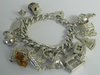 A Stunning Vintage Solid Silver Charm Bracellet,  13 Charms Rare,  Open 104grams