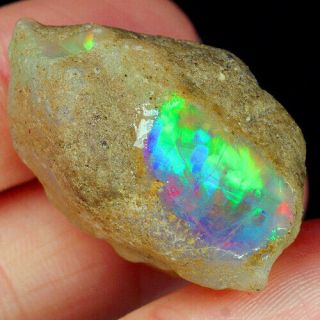 63.  8ct Natural Ethiopian Crystal Black Opal Play Of Color Rough Specimen Ysjg863