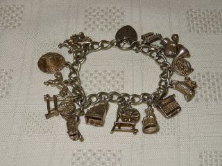 Vintage Solid Silver Charm Bracelet - 36 Grams - 14 Charms - Some Rare Lond 1972