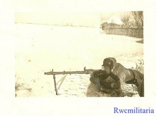 Deadly Wehrmacht M.  G.  34 Machine Gunner Laying Prone In Russian Winter