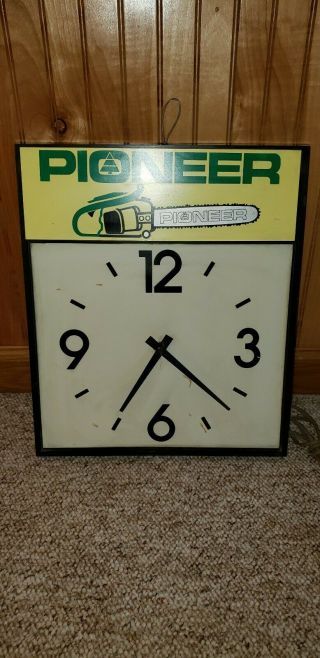 VINTAGE PIONEER DEALER CHAINSAW CLOCK, . 2