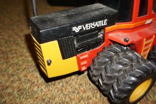 VINTAGE ERTL 4WD VERSATILE TOY FARM & CONSTRUCTION TRACTOR W/ TRIPLES 1/16TH 9