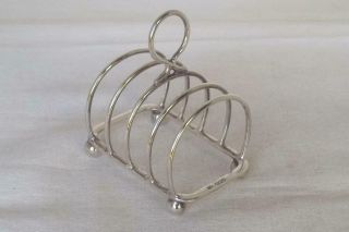 A Solid Sterling Silver Five Bar Four Slice Toast Rack Sheffield 1955.