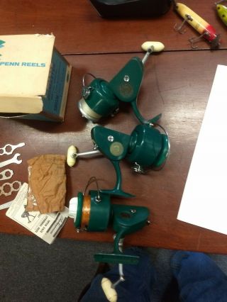 3 VINTAGE PENN 712 spinning reels with 1box and paperwork 2