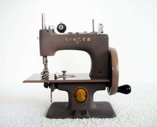 Vintage Singer Toy Hand Crank Sewing Machine.