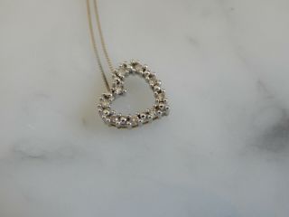 A Stunning 9 Ct White Gold Diamond Heart Pendant And Chain