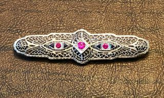 Estate/Vintage 14kt White Gold Brooch with Red and Blue Stones,  6.  4 gms,  2.  75 