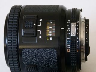 Rare Nikon Nikkor 80mm f/2.  8 AF with caps,  UV filter and HS - 7 hood, 2