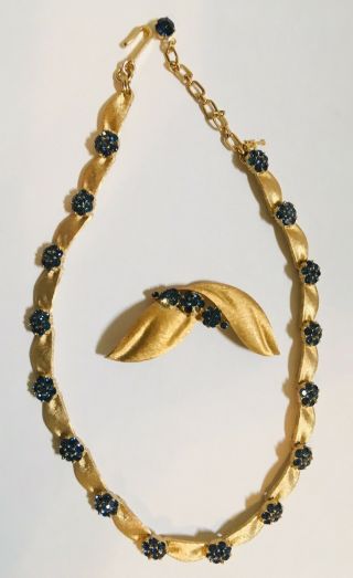 Trifari© Blue Rhinestone Florets Matte Gold Tone Ribbon Necklace,  Matching Pin