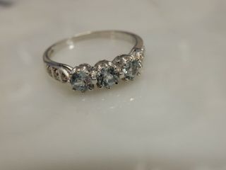 A Stunning 9 Ct White Gold Three Stone Aquamarine And Diamond Ring