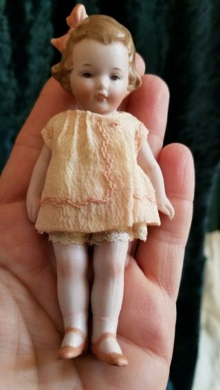 4.  25 " Vintage All Bisque Child Doll With Molded Bow,  Silk Dress Marked Germany