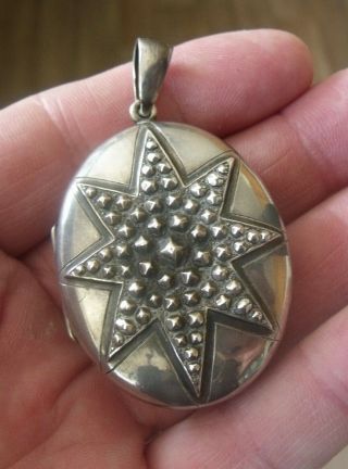 An Antique Sterling Silver 1882 Hallmarked Larger Size Locket.  Engraved To Rear.