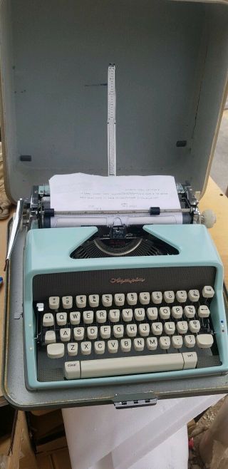 Vintage Olympia Deluxe Portable Typewriter W/ Case.