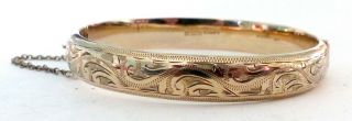 A 1957 Birmingham Hallmarked Gold On Silver Opening Bangle With A Scroll Design