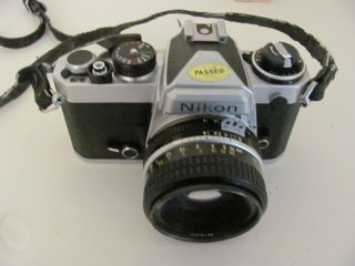 Vintage Nikon Fe 35mm Slr Film Camera With A 50mm Nikon Nikkor 1:1.  8 Lens