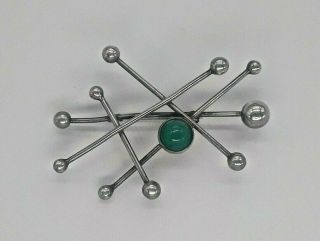 N.  E.  From Sterling Mid Century Pin With Green Stone