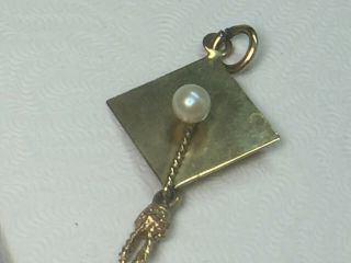 14k Yellow Gold Pearl Graduation Cap With Dangling Tassel Charm.  1.  5gm.