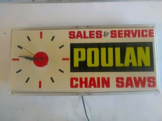 Vintage Poulan Chainsaw Advertising Clock.  26 " X 12 " Lighted