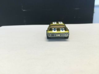Redline Hotwheels Olds 442,  Yellow. ,  soft wing,  Not sure on stripes. 10
