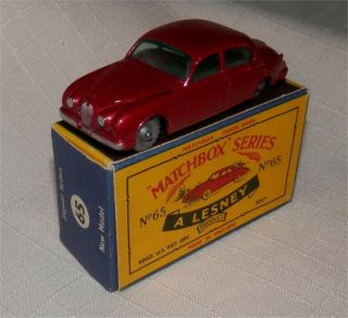 Dark Metallic Red.  1960s.  Matchbox Lesney.  65 Jaguar Sedan,  Spw.