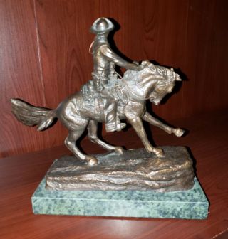 Cowboy bronze statue by Remington 2